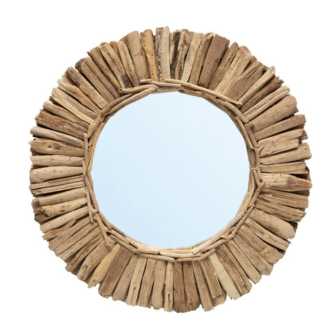 This round mirror, perfect for a feature wall, boasts a rustic frame crafted from unevenly cut driftwood pieces that radiate outward. It reflects a clear blue sky, imparting an open feel, while the natural wood texture adds warmth and character.