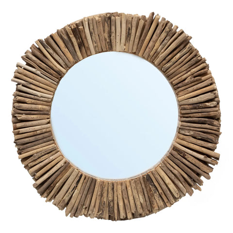 Round mirror with a frame crafted from driftwood sticks arranged radially, echoing the sun's rays. The wood's natural, weathered look enhances its rustic and earthy charm, making it a perfect centerpiece for any feature wall.