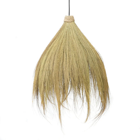 A boho pendant lamp with a natural, broom-like design hangs from a thin black cord. It features long, wispy, beige fibers that fan out, resembling a traditional broom or grass skirt, perfect for enhancing your bedroom lighting.