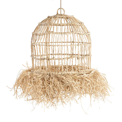 The Casita pendant is a woven, dome-shaped hanging light fixture crafted from natural fibers. Its bottom features a fringe of straw-like mendong grass, enhancing its rustic and organic appeal reminiscent of a tropical paradise.