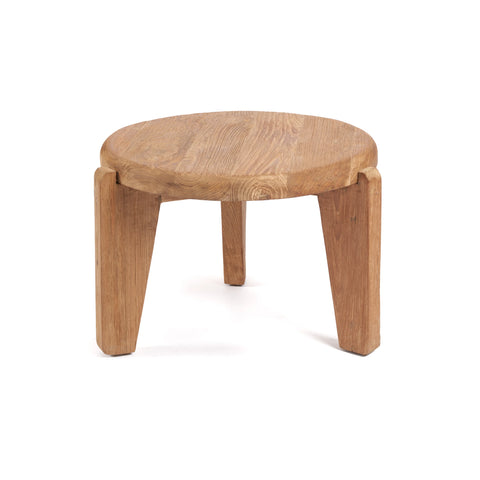 A small wooden stool with a round top and three sturdy legs, crafted from rustic wood. This minimalist piece boasts a light hue and eco-friendly charm, set against a plain white background.