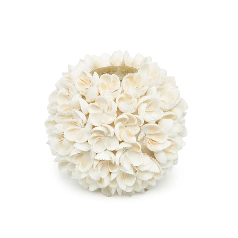 A spherical vase, handmade with intricately arranged white seashells, forms a floral pattern. The shells provide a textured, natural appearance to the decorative piece, making it a perfect coastal tealight holder.