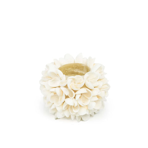 A handmade tealight holder adorned with delicate, white seashells arranged in a floral pattern. The spherical design adds a boho touch as it sits on a plain white background, perfect for creating an inviting ambiance.