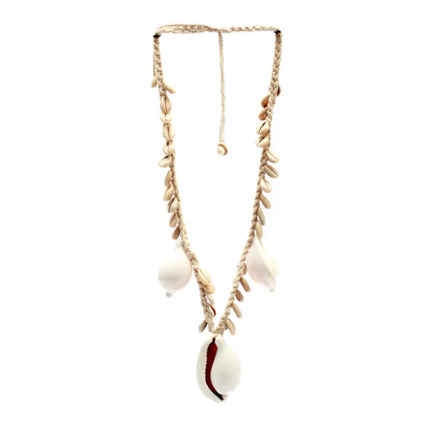 This boho luxe necklace is crafted from braided fibers, adorned with various shells. It features large and small shells, including a prominent central shell with a red interior, reminiscent of the iconic Big White Cowrie Necklace style.