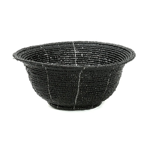 A handmade black basket with white stitching, featuring a wide, rounded shape and textured surface. This boho chic decorative item adds a touch of elegance to your home interior.