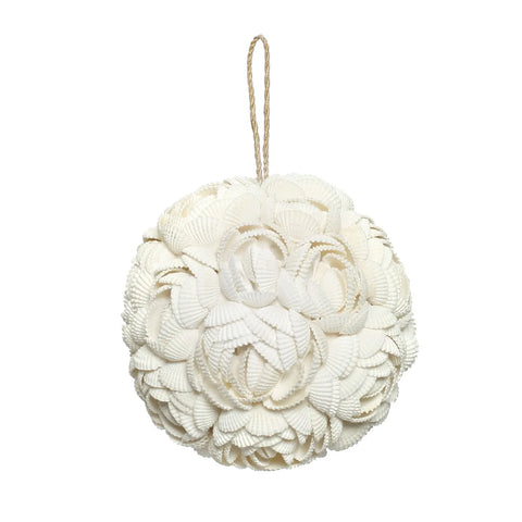 A spherical ornament made of white seashells, intricately crafted in a floral pattern by skilled Balinese craftsmen, with a twine loop for hanging, set against a plain white background.