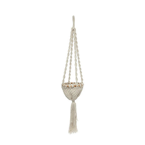 A macramé plant hanger with intricate knotting and tassels elegantly showcases a macramé basket against a plain background. It consists of four braided cords connected to a woven cradle designed to hold hanging plants in perfect style.