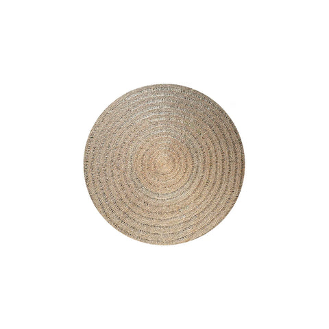 A hardwearing, round woven straw placemat in a natural color showcases its textured pattern against a plain white background, reminiscent of a seagrass carpet's earthy elegance.