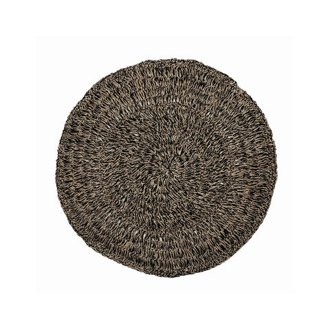 A round, woven placemat or rug with a textured, braided design in earthy brown tones combines natural black accents. Crafted with hardwearing durability, it boasts a rustic charm that highlights intricate patterns created by the intertwining fibers, reminiscent of seagrass carpet appeal.