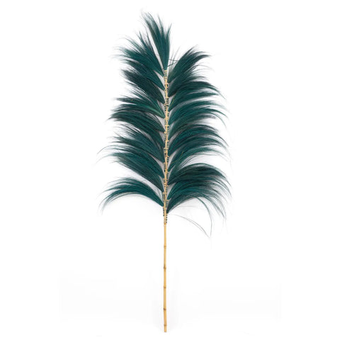 A single tall, green faux pampas grass stem with fluffy plumes on a light background serves as a stunning decorative element. The straight, golden-brown stem contrasts beautifully with the lush, dark green of the feathers, enhancing any home interior with its elegant presence.