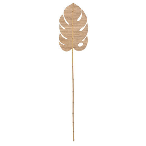 A decorative wooden monstera leaf cutout, crafted with natural materials and attached to a thin bamboo stick to resemble a plant stem, embodies a boho charm. Perfectly isolated on a white background, it's reminiscent of tranquil days spent drifting down the Sungi River Paddle.