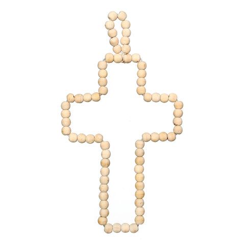 A decorative cross made of small, round wooden pearls arranged in a symmetrical pattern. The beads create the outline of the cross with a simple loop at the top. The plain white background highlights the handmade charm and natural color of the wood.