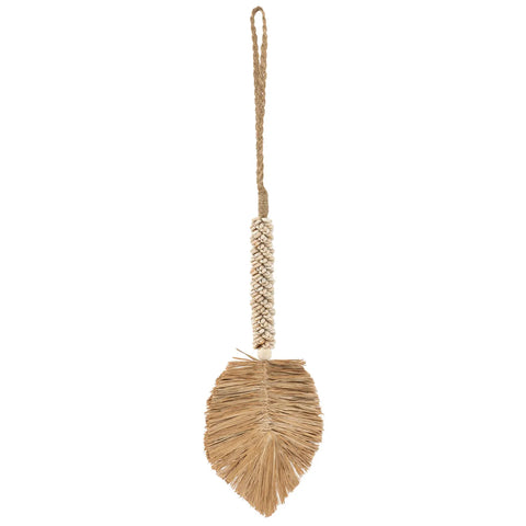 A handmade bohemian decorative item crafted from natural materials, featuring a woven handle with a loop at the top and a leaf-shaped bottom adorned with a tassel. The piece has intricate, earthy textures and patterns perfect for home decoration.