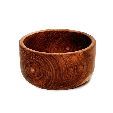 A round teak wood salad bowl with a smooth surface and natural grain patterns, featuring concentric circles and warm brown tones. The durable design includes thick walls and a flat base.