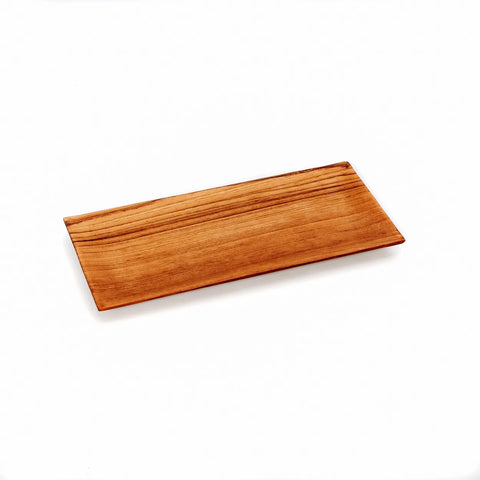 A natural wood tray with a light brown finish showcases visible wood grain patterns. This rectangular plate, crafted from teak wood, is empty and set against a plain white background.