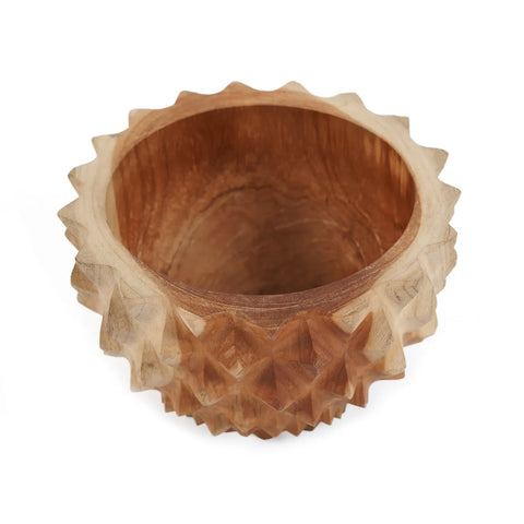 A rustic, handcrafted teak wood bowl with a smooth interior and an exterior showcasing sharp, geometric carvings, creating a spiked effect around the rim. This durian bowl offers a warm, natural finish, making it a striking decorative centerpiece for any setting.