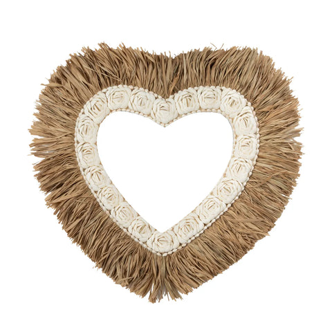 A heart-shaped photo frame with a textured design, featuring elegant raffia fringes on the outer edge. The inner section showcases a delicate arrangement of white rose formations. The center is ready for your cherished photo.