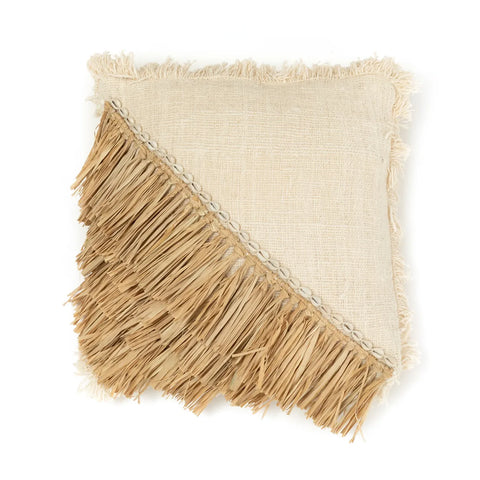 A square beige pillow with raffia fringes and a diagonal natural fiber design exudes a bohemian coastal vibe, creating textured contrast with its smooth fabric. The fringes resemble strands of straw, perfect for adding an earthy touch to any space.