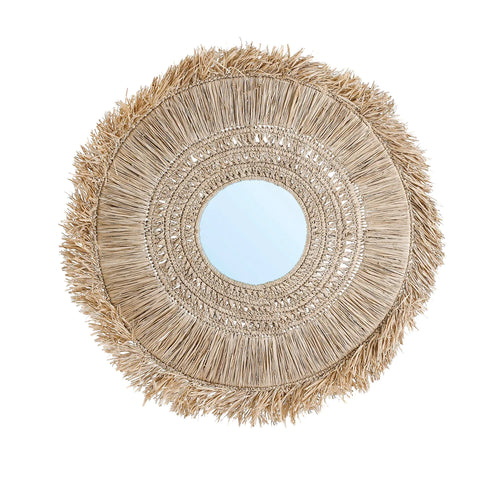 The Yuki mirror features a round wall design with a decorative straw frame, boasting layers of natural fibers in a radial pattern. Its raffia weavings lend it a rustic, bohemian appearance, perfect for adding a coastal vibe to any space.