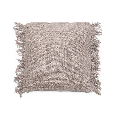 A square, beige woven pillow with frayed edges on all sides exudes a boho vibe, set against a plain white background.