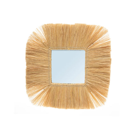 A square mirror with a decorative frame made of natural straw-like fibers radiates outward, creating a textured and rustic appearance. Part of our limited edition collection, this piece embodies artisanal craftsmanship.