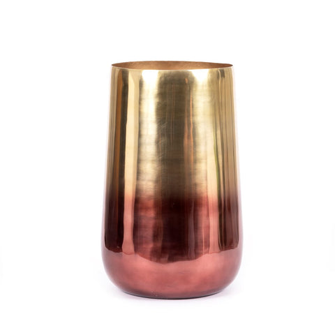 A tall, cylindrical metal vase serves as a luxurious planter with a smooth gradient from shiny gold at the top to reflective copper at the bottom, perfect for elevating any indoor living space against its plain white background.