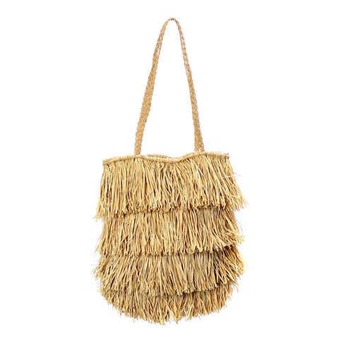 A fringed, straw shoulder bag exuding a boho feel, with layered tassels and a single strap, perfect as a Bahamas tote against a white background.