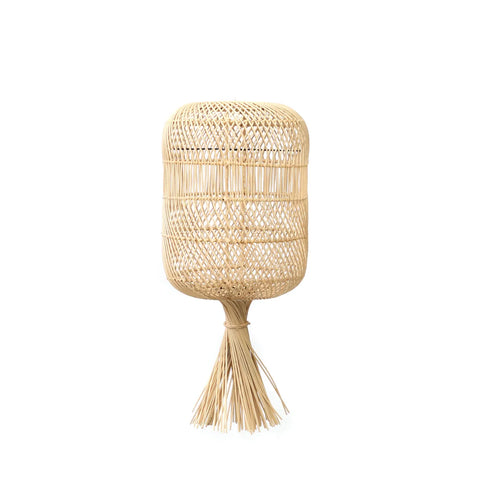 A woven rattan lampshade with an intricate pattern, featuring a dome shape and a tassel-like finish at the base. Its natural light brown color enhances its rustic and boho look, making it a charming addition to any space.