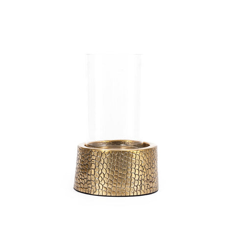 A transparent glass vase features a gold-toned, textured base with a croco print pattern resembling scales. This modern and minimalist design beautifully showcases a blend of clear and metallic elements, resembling an exquisite candle holder.