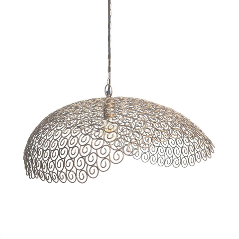 The Nuage pendant is a hanging light with an intricately designed, dome-shaped metal shade featuring ornate, oriental patterns. The metal appears in a bronze or copper hue, complemented by a chain for hanging, blending traditional artistry with modern design.