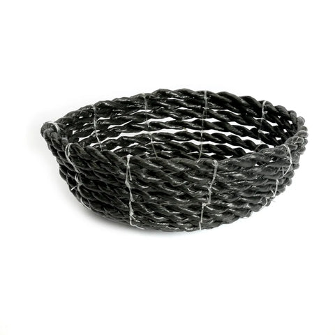 A dark green, handwoven seagrass bowl with an open, twisted pattern, perfect for serving snacks, is displayed against a plain white background.