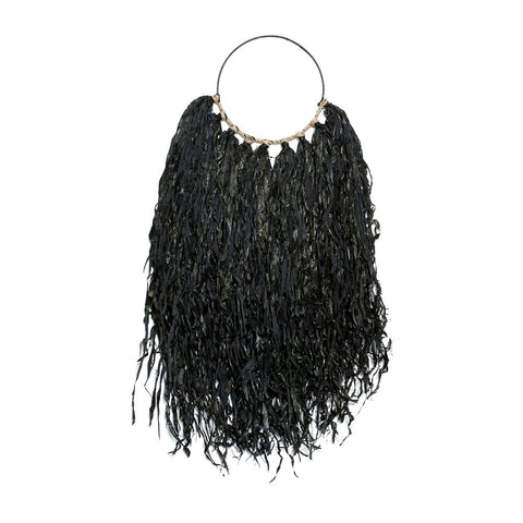 A black wall hanger featuring long, thin strips resembling seaweed attached to a circular frame, with shell accents at the top, adding a bohemian look.